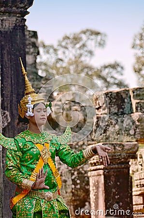 Angkor-Tom, Cambodia â€“ November 12, 2014: Khmer classical female dancer performing in traditional Cambodian costume Editorial Stock Photo